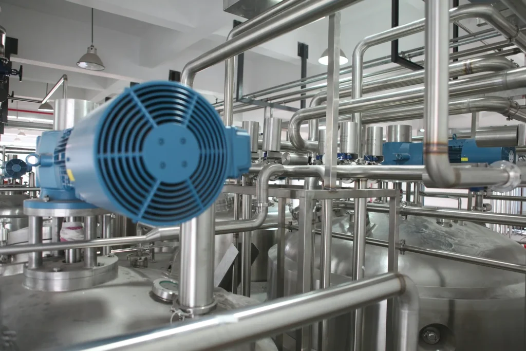 Industrial electric motor and pump system in a processing plant