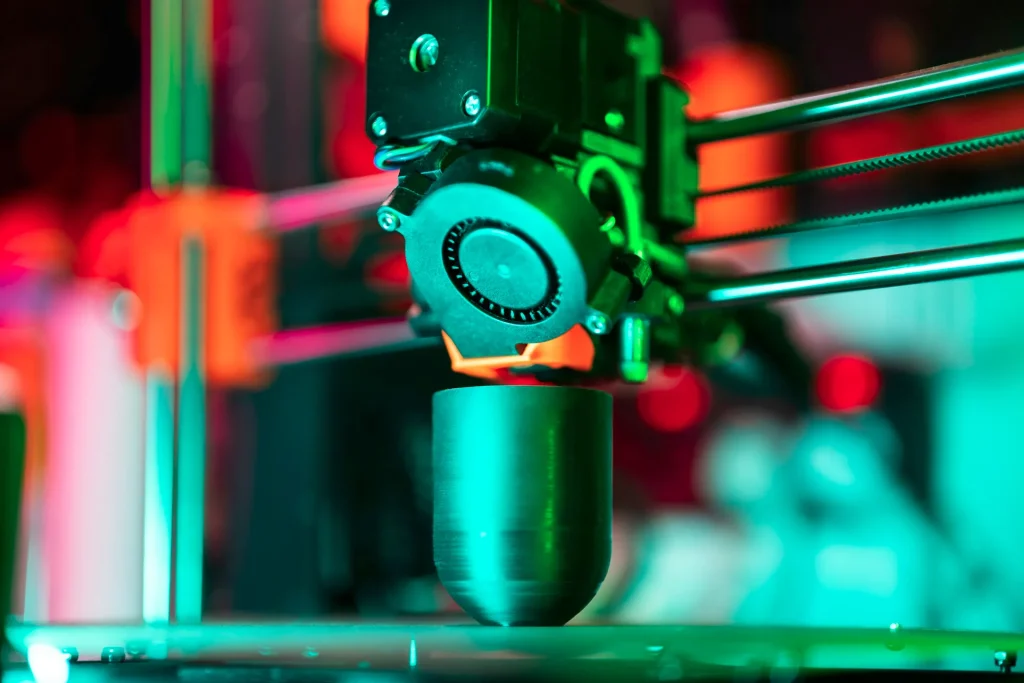 Close-up of a laser cutting or welding head in action