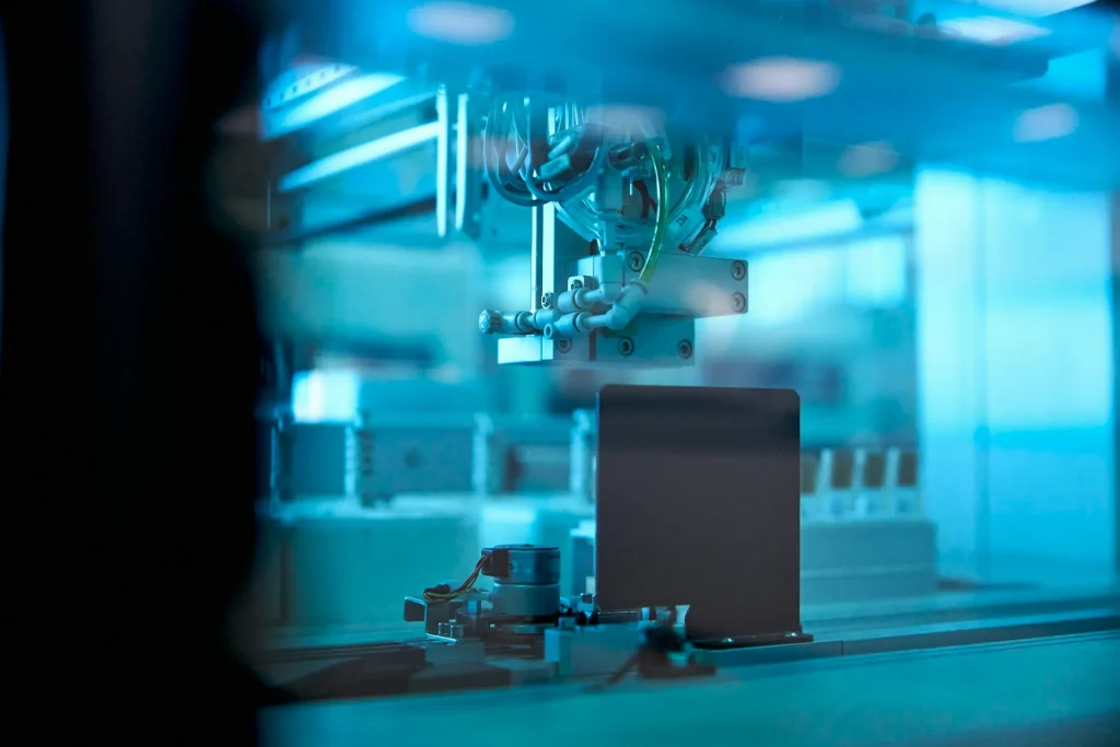Robotic arm performing precision assembly in a factory